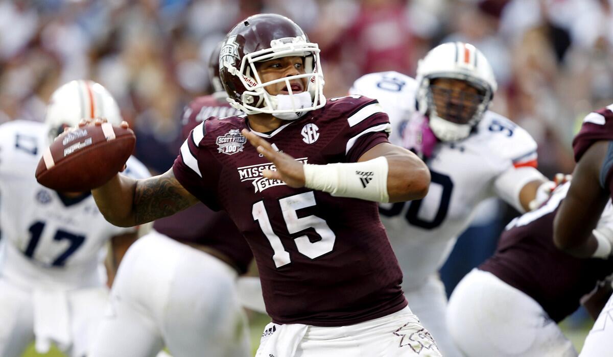 Quarterback Dak Prescott (15) and No. 1-ranked Mississippi State put their unbeaten record on the line at Kentucky this weekend.