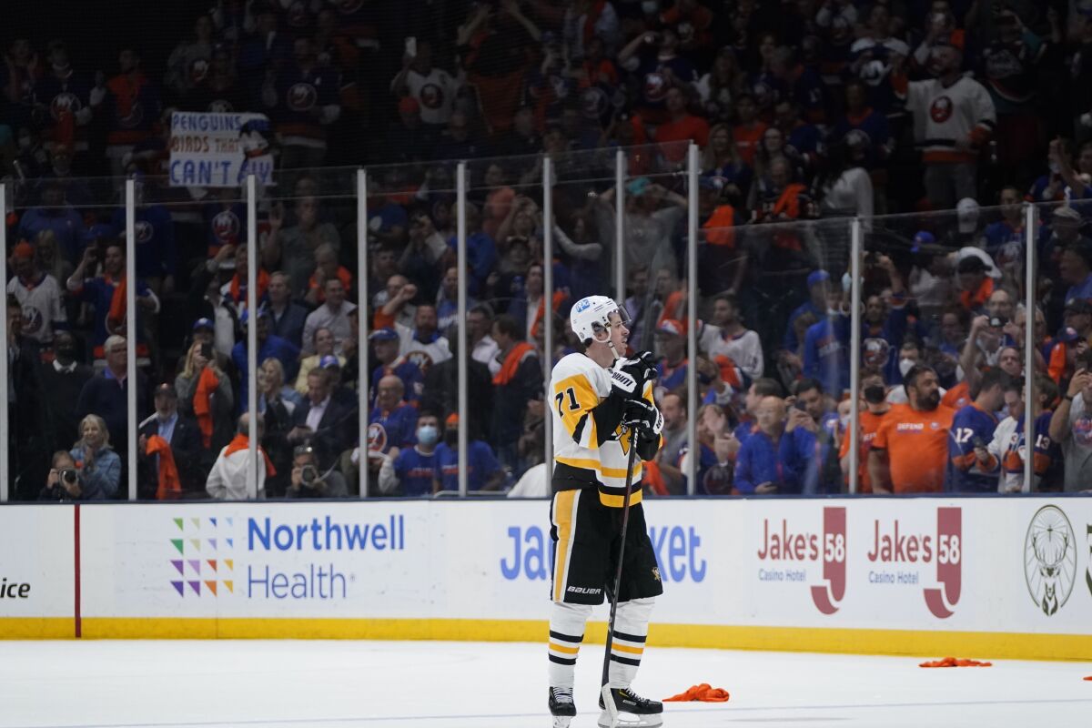 Pittsburgh Penguins' Evgeni Malkin (71) reacts after Game 6 of an NHL hockey Stanley Cup first-round playoff series against the New York Islanders, Wednesday, May 26, 2021, in Uniondale, N.Y. The Islanders won 5-3. (AP Photo/Frank Franklin II)