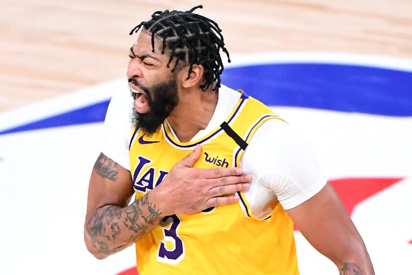 Lakers forward Anthony Davis celebrates his three-pointer against the Heat in Game 4 of the NBA Finals on Oct. 6, 2020.