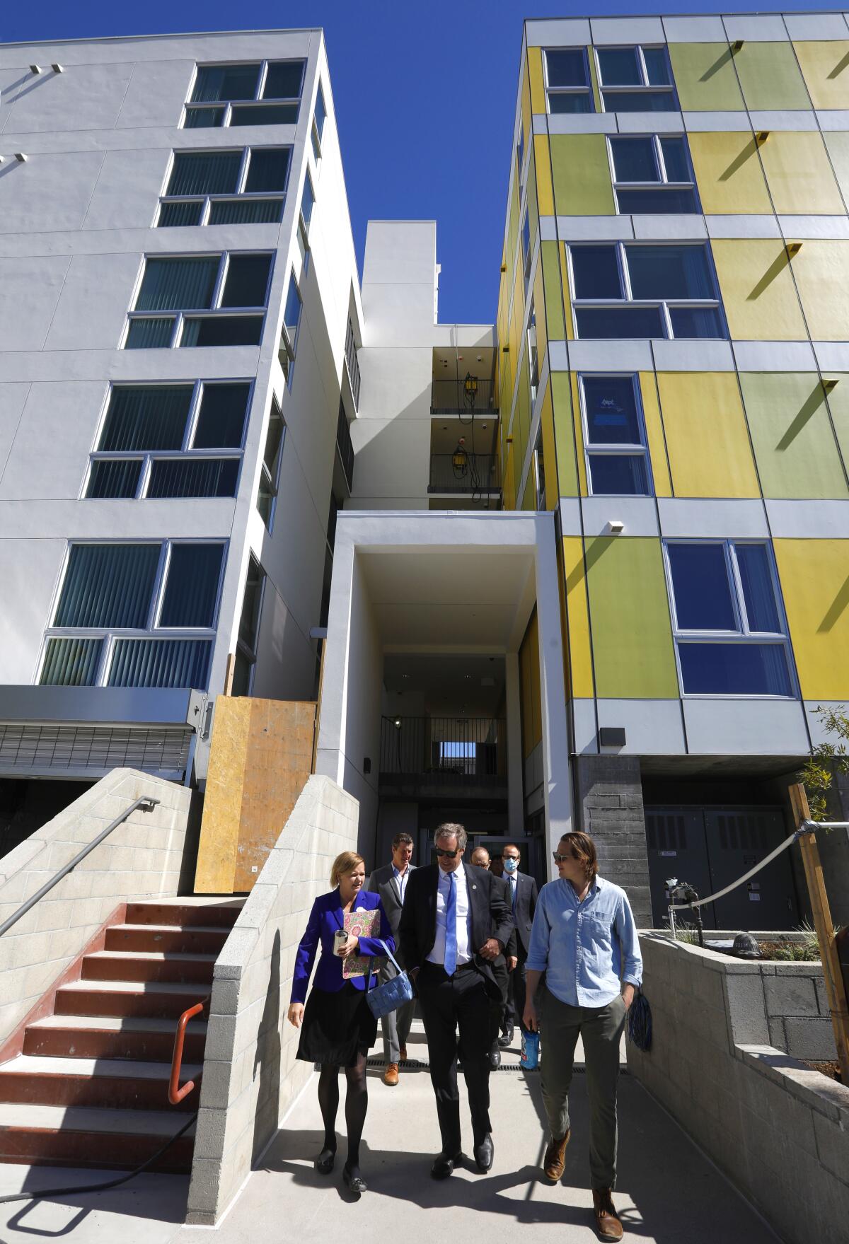 Top lawmakers and state officials tour a new apartment building in Mar Vista.