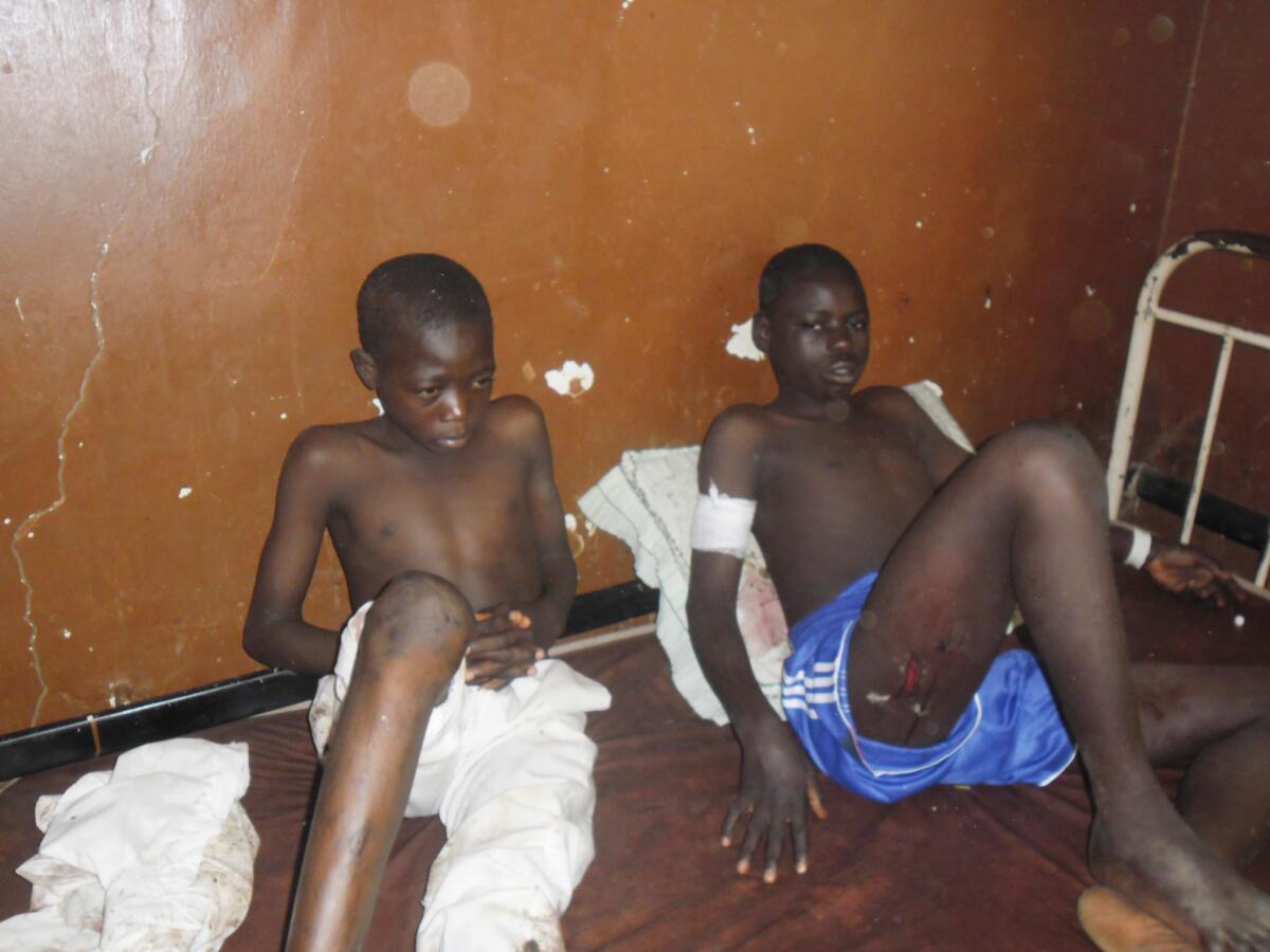Victims of a suicide bombing at a high school are treated at the general hospital in Potiskum, Nigeria, on Nov. 10.