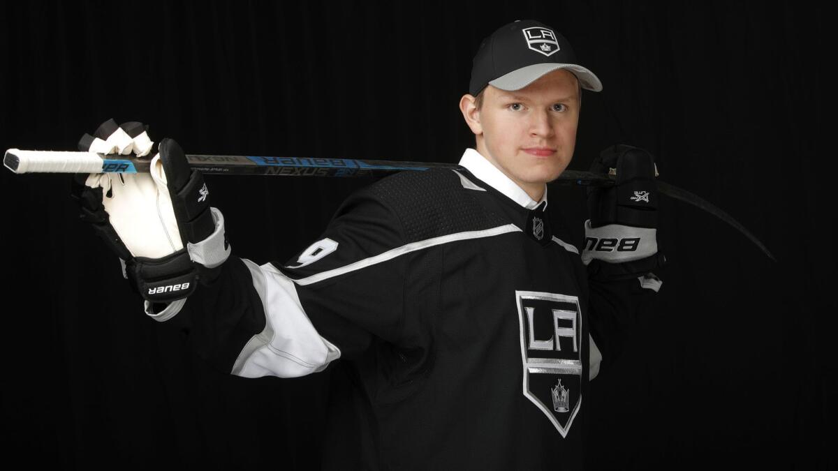 Arthur Kaliyev poses for a photo after being selected 33rd overall by the Kings during the NHL draft on June 22, 2019.
