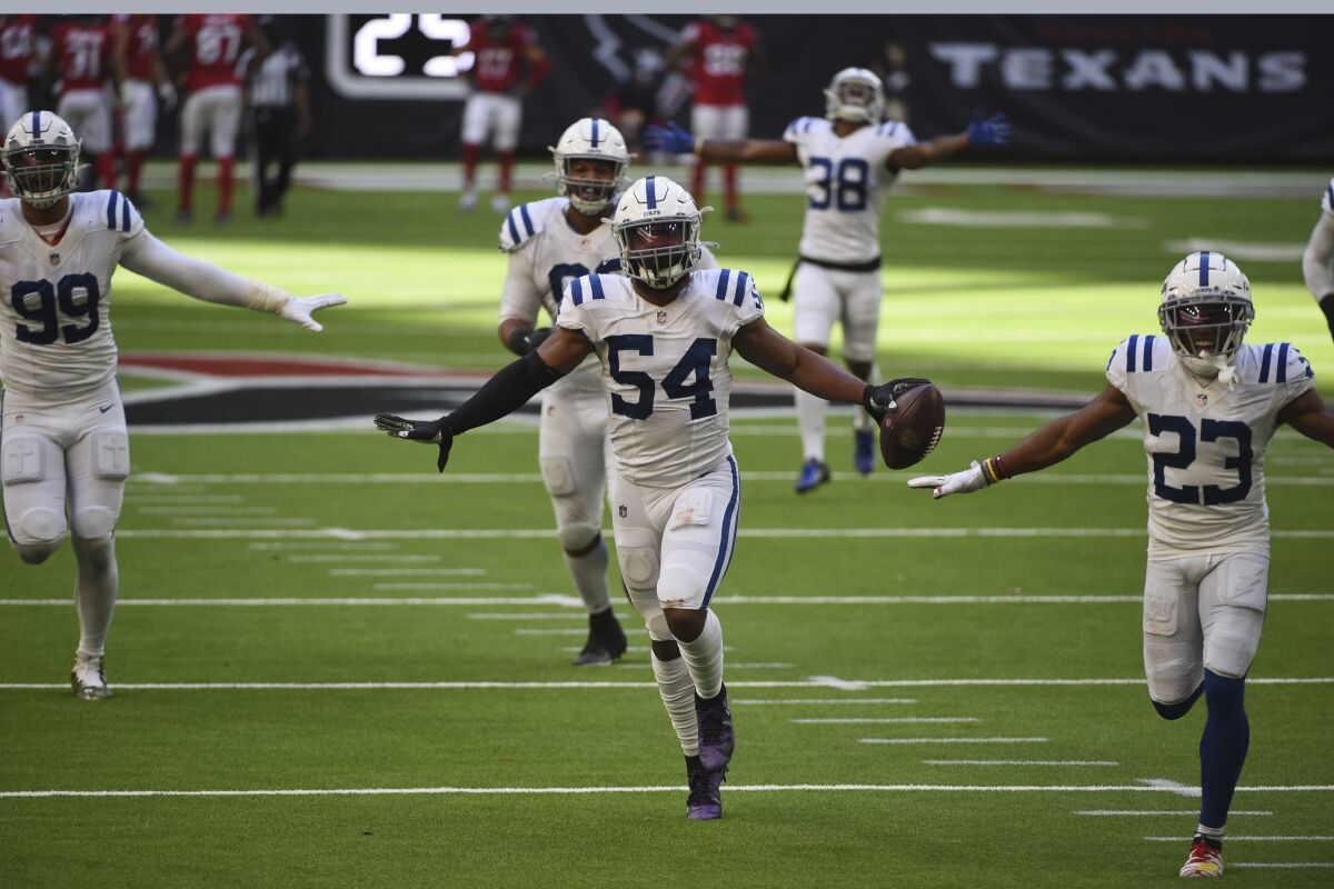 Indianapolis Colts middle linebacker Anthony Walker (54) celebrates with teammates after he recovered a fumble by Houston Texans quarterback Deshaun Watson during the second half of an NFL football game Sunday, Dec. 6, 2020, in Houston. (AP Photo/Eric Christian Smith)