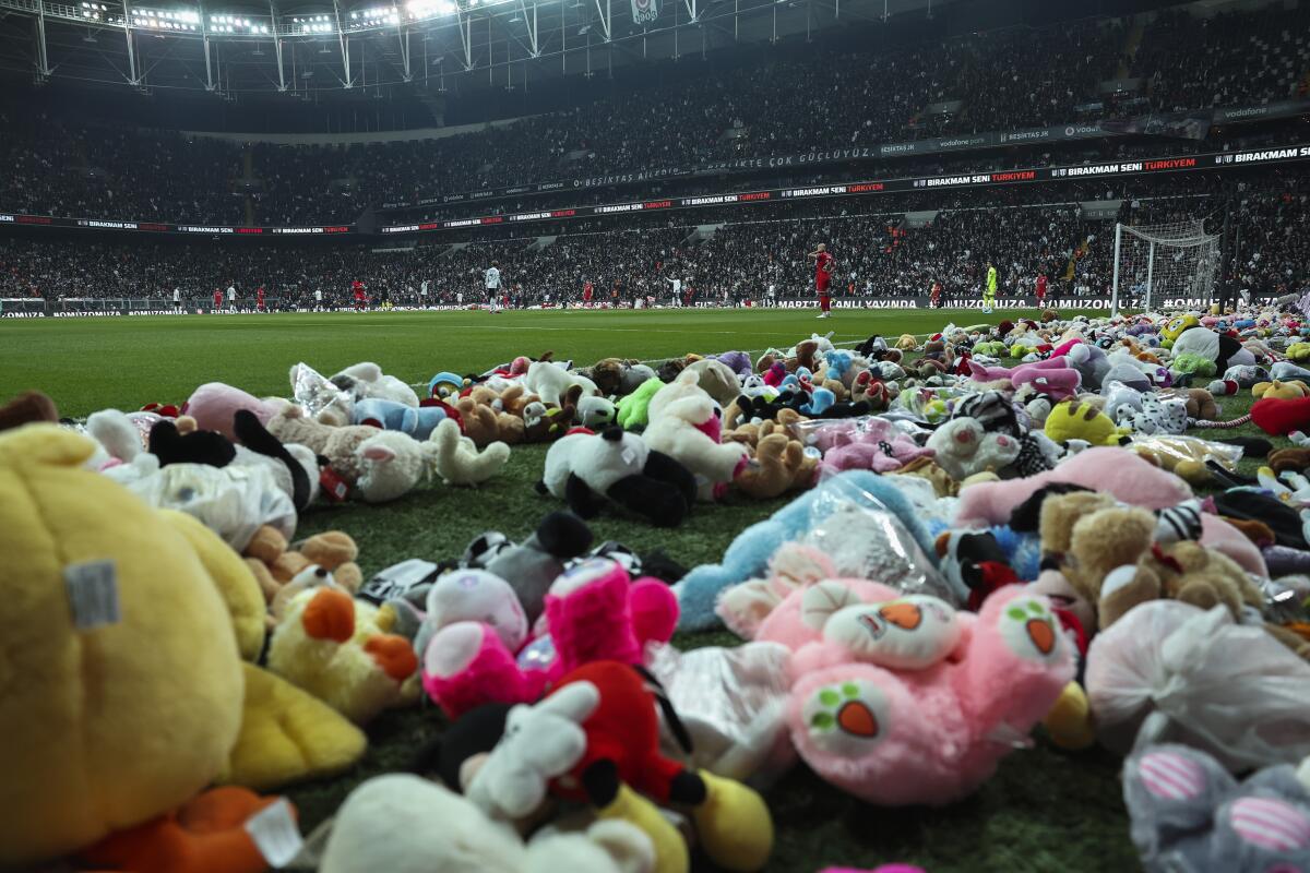 Players resume the game after a delay while fans threw toys onto the field in support of earthquake victims.