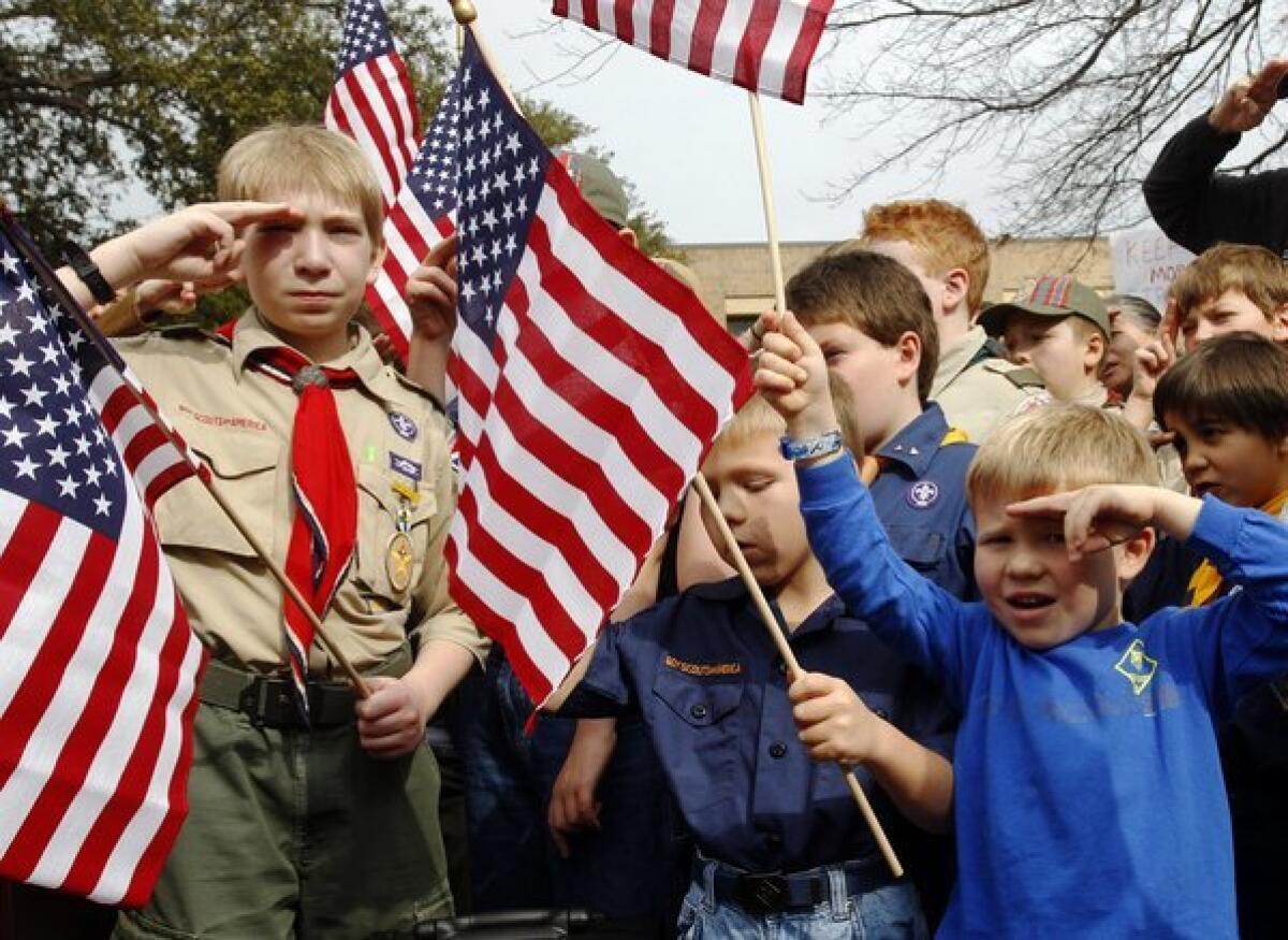 Scouts salute at a February rally in Dallas, opposing the inclusion of gays in the organization.