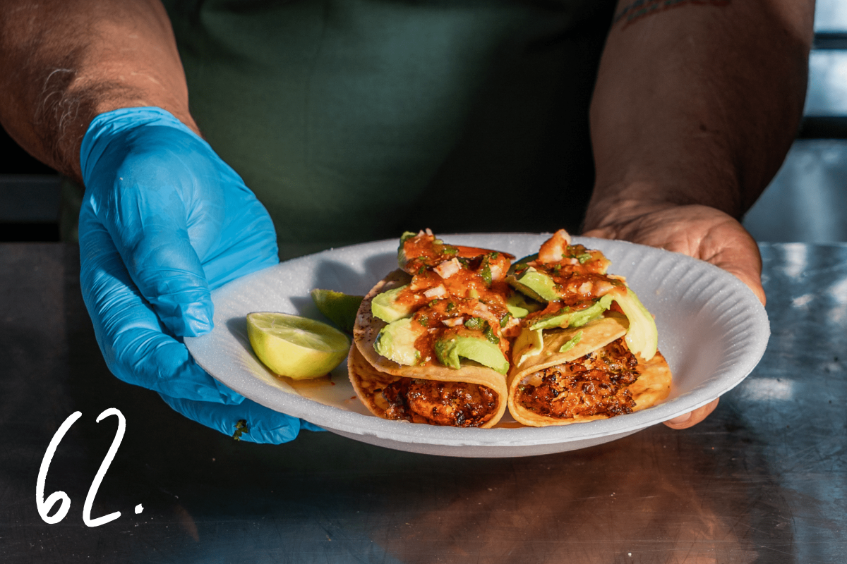 #62: Owner Raul Ortega holds a plate of Tacos de Camaron 