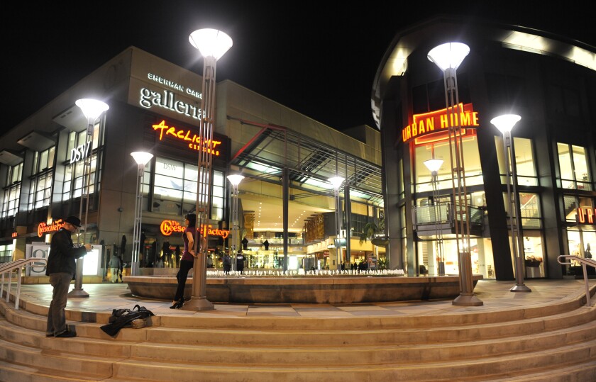 Night view of the illuminated facades of shopping centers