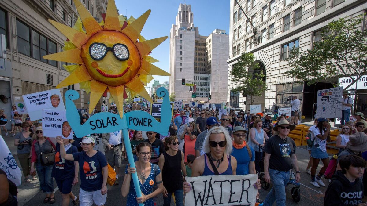 People participate in the March for Science Los Angeles downtown.