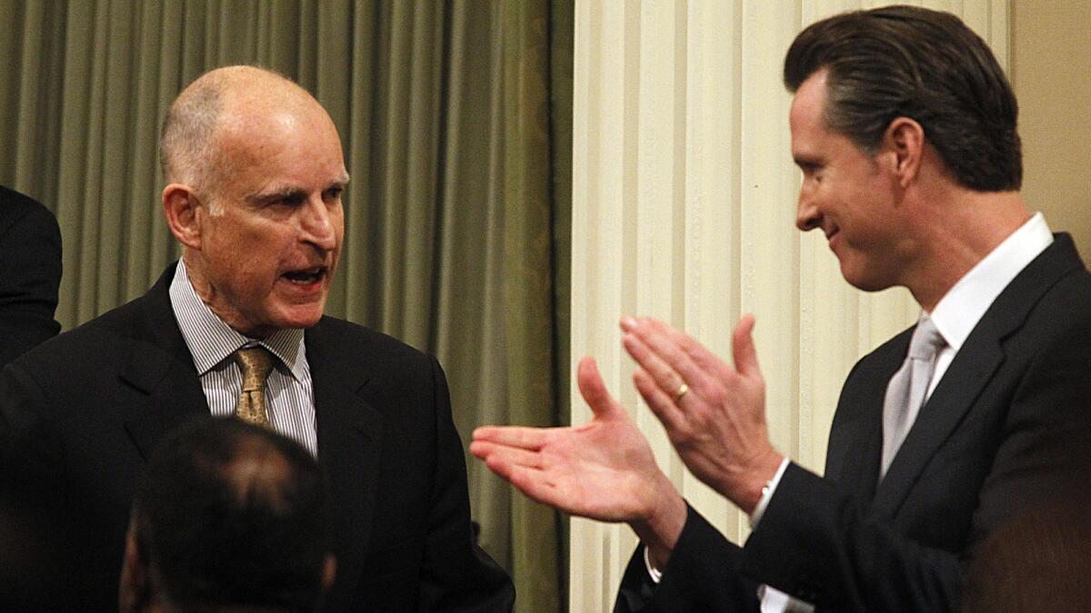 Lt. Gov. Gavin Newsom applauds for Gov. Jerry Brown after a State of the State speech.