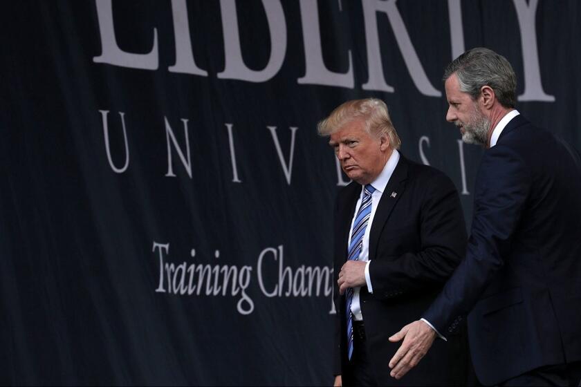 LYNCHBURG, VA - MAY 13: Accompanied by President Jerry Falwell (R), U.S. President Donald Trump (L) leaves after he delivered keynote address during the commencement at Liberty University May 13, 2017 in Lynchburg, Virginia. President Trump is the first sitting president to speak at Liberty's commencement since George H.W. Bush spoke in 1990. (Photo by Alex Wong/Getty Images) ** OUTS - ELSENT, FPG, CM - OUTS * NM, PH, VA if sourced by CT, LA or MoD **