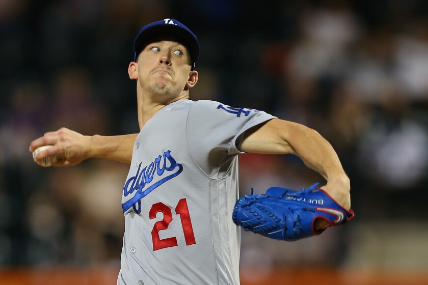 Dodgers starter Walker Buehler delivers against the New York Mets on Sunday.