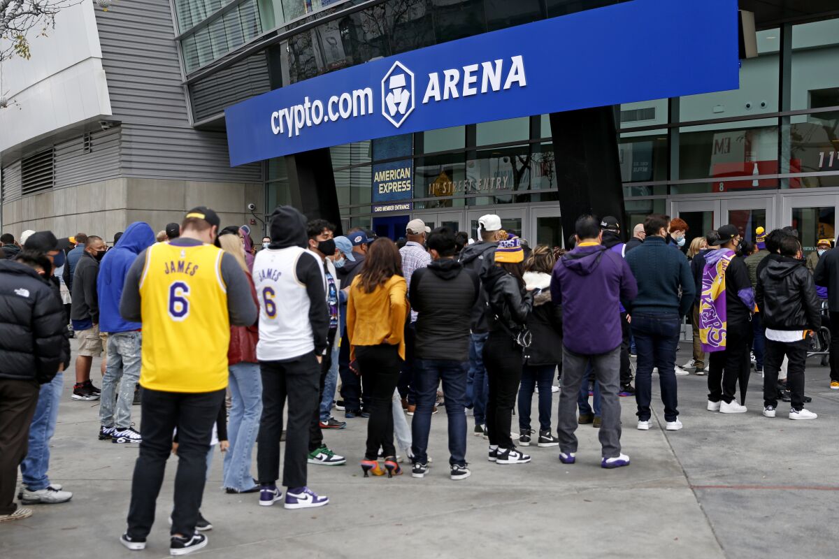 Fans line up before the start of a Lakers game.