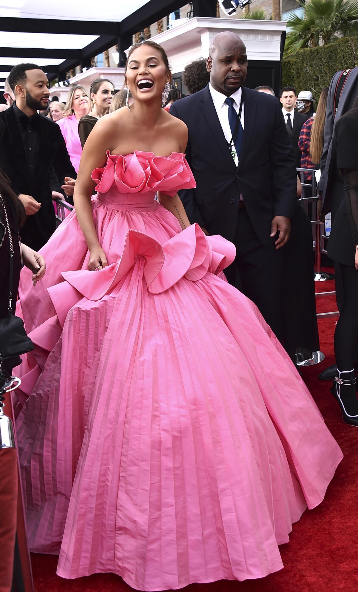 Chrissy Teigen arrives at the 64th Grammy Awards.