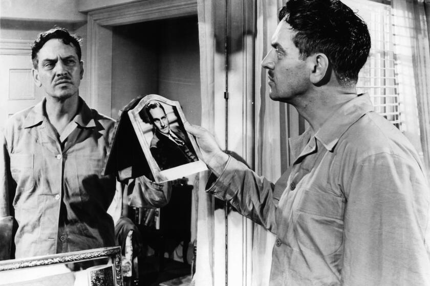 Fredric March looking into mirror in a scene from the movie 'The Best Years Of Our Lives', 1946. (Photo by RKO Radio Pictures/Getty Images)