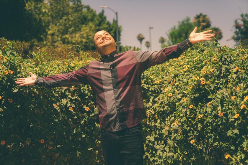 Los Angeles, CA: July 13, 2022: Comic Frankie Quinones, 'the CholoFit guy, photographed at and around a friend's home. 'The stand-up comedian-turned-viral TikTok star talks about the L.A.-roots of sketches based on his family. (CREDIT: Samanta Helou Hernandez / For The Times)