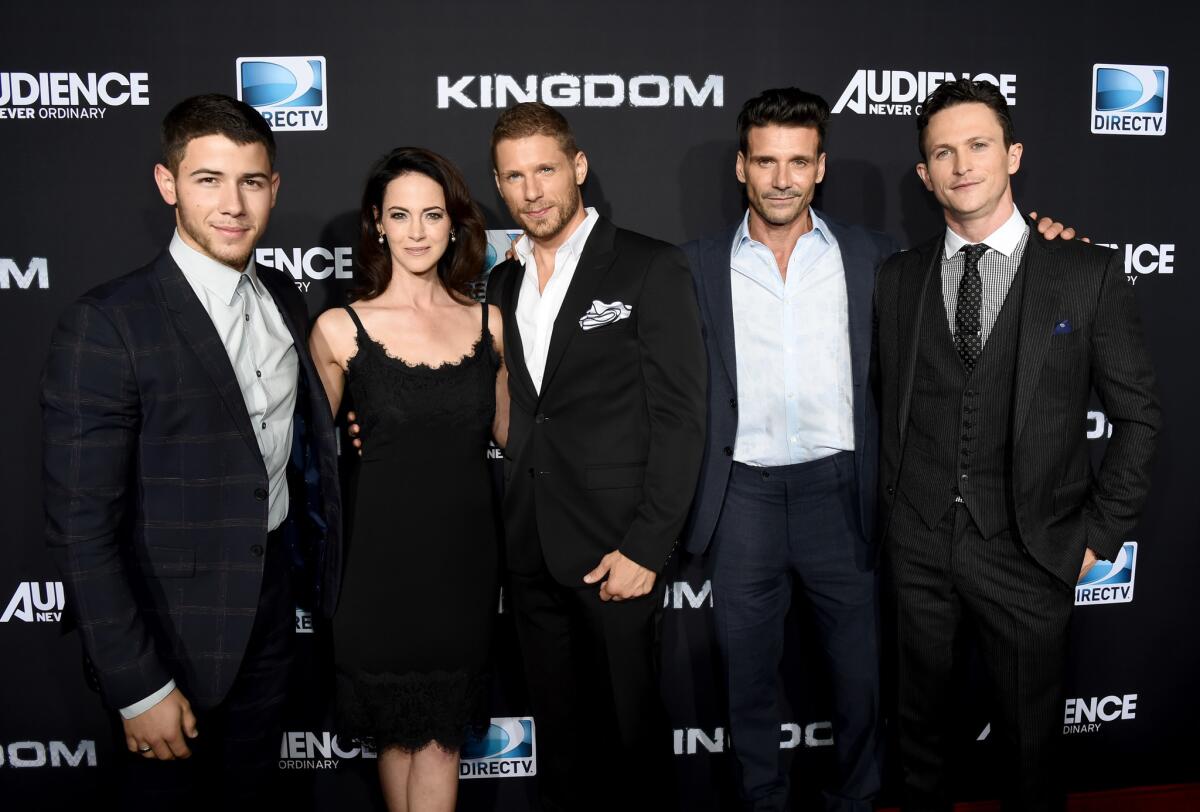 Actors Nick Jonas, left, Joanna Going, Matt Lauria, Frank Grillo, and Jonathan Tucker attend the premiere event for DirecTV's "Kingdom."
