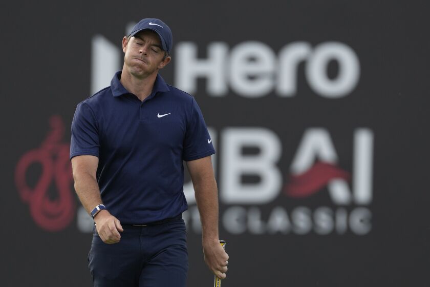 Rory McIlroy of Northern Ireland reacts after missing a ball on the 18th hole during the competition of the second round of the Dubai Desert Classic, in Dubai, United Arab Emirates, Saturday, Jan. 28, 2023. (AP Photo/Kamran Jebreili)