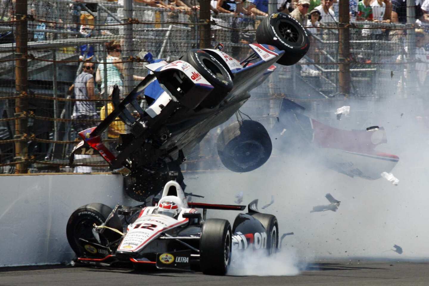 The car of driver Mike Conway goes airborne as it collides with the car of Will Power in the first turn on Sunday during the Indianapolis 500.