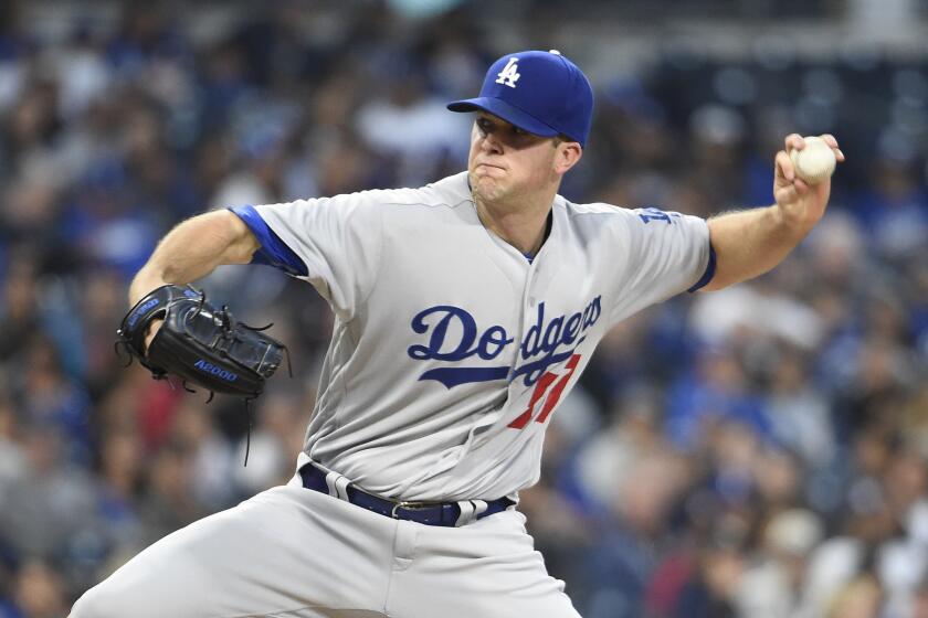 Left-hander Alex Wood was not on the Dodgers' roster for the division series playoff.