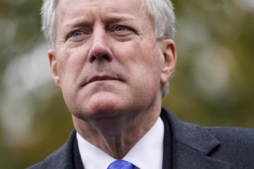 FILE - White House chief of staff Mark Meadows speaks with reporters outside the White House, Oct. 26, 2020, in Washington. Meadows, Donald Trump's former chief of staff, is cooperating with a House panel investigating the Jan. 6 Capitol insurrection and providing some documents, putting off for now the panel's threat to hold him in contempt, the committee's chairman said Tuesday, Nov. 30, 2021. (AP Photo/Patrick Semansky, File)