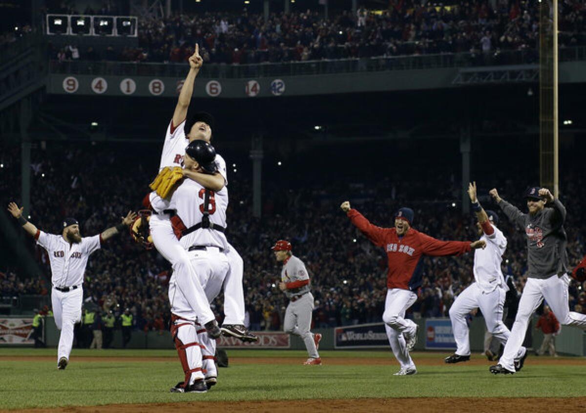 Members of the Boston Red Sox celebrate their World Series victory.