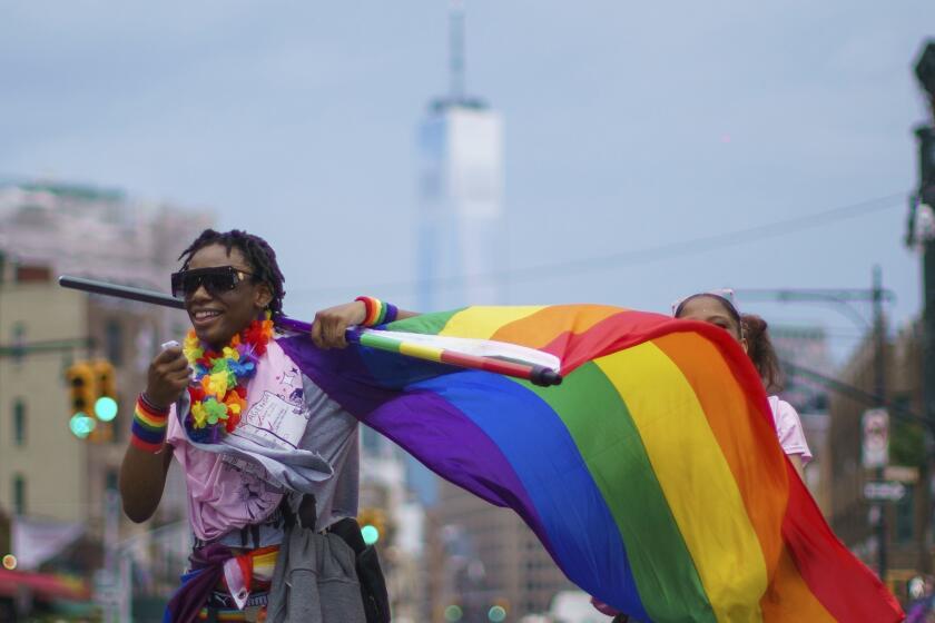 FILE - Revelers participate in the NYC Pride March, Sunday, June 25, 2023, in New York. Pride Month starts Saturday, June 1, 2024, across the U.S. and the globe, an annual celebration of LGBTQ+ people and culture. The main events are parades and festivals held in cities large and small. (AP Photo/Eduardo Munoz Alvarez, File)