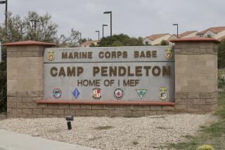 FILE - The entrance to Marine Corps base Camp Pendleton is seen on Sept. 22, 2015, in Oceanside, Calif. A Camp Pendleton Marine was detained for questioning after military police found a 14-year-old girl on base June 28, 2023. The girl's grandmother in San Diego reported her missing June 13. (AP Photo/Gregory Bull, File)