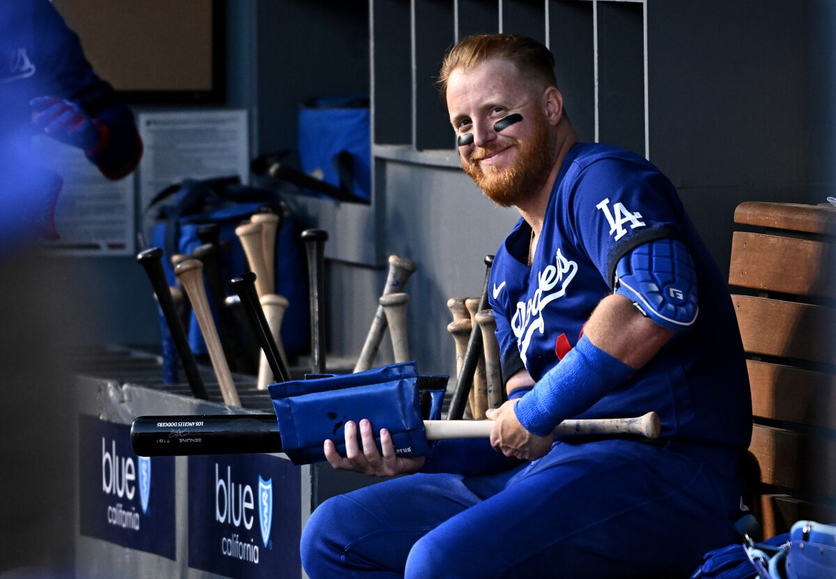 Dodgers third baseman Justin Turnersits in the dugout at Dodger Stadium during a game on August 22.