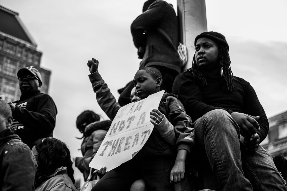 Residents of Baltimore gather during the community’s response to the 2015 in-custody death of Freddie Gray. The photo is part of a collection called “the Impact of Images” collection curated by Lead With Love, in collaboration with the studio and production company behind the film “Till.” (Devin Allen via AP)