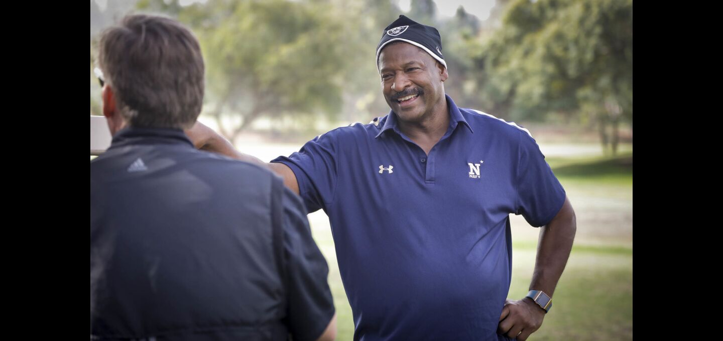 Napoleon McCallum who played football for the U.S.Naval Academy and Oakland Raiders, talks will fellow golfers in the Navy-Notre Dame Golf Tournament at the Riverwalk Golf Club in Mission Valley in advance of the football game between the two schools to be held at SDCCU Stadium, Saturday.