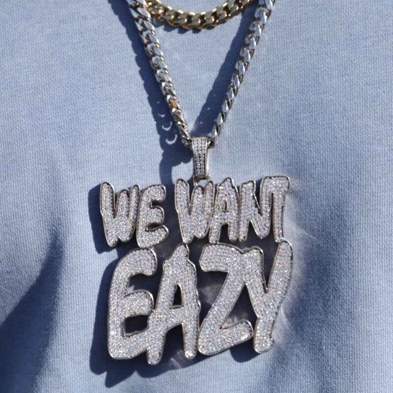 Another attendee wears a 'We Want Eazy' chain.