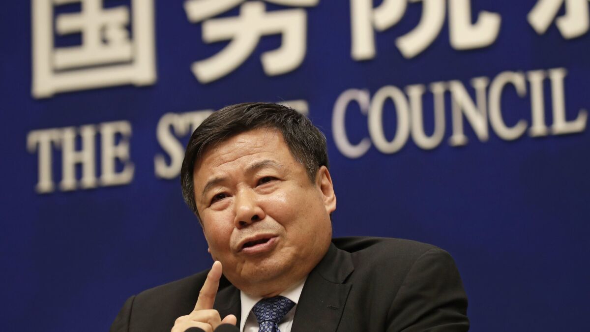 Chinese Finance Vice Minister Zhu Guangyao speaks during a news conference on trade issues at the State Council Information Office in Beijing on April 4.