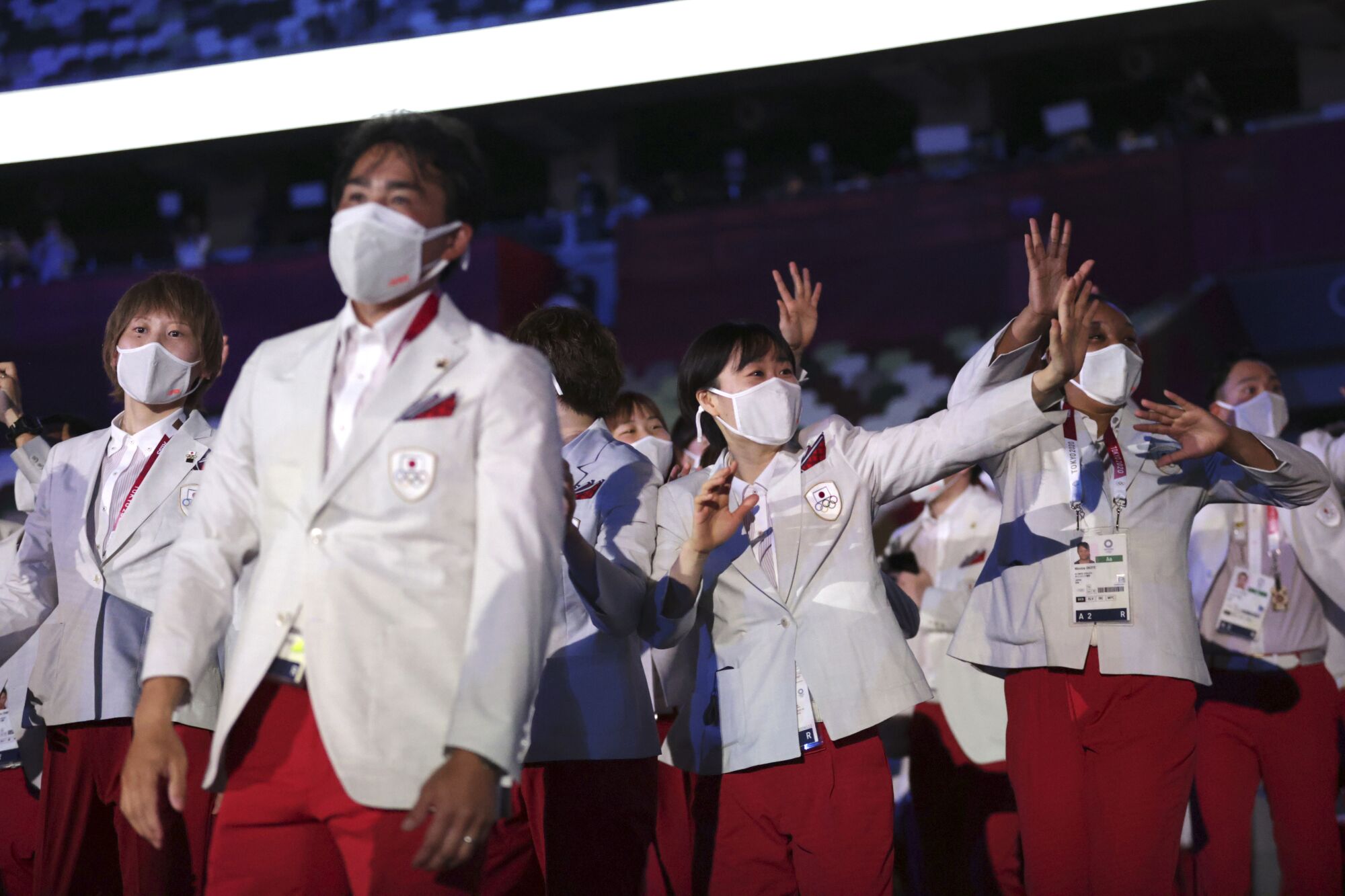 Members of Team Japan arrive during the opening ceremony.