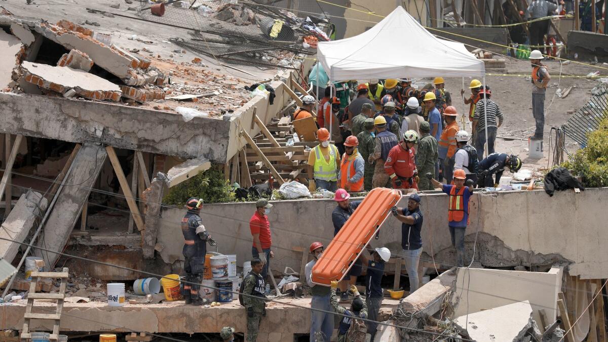 Rescue teams continue searching for students trapped in the rubble at Enrique Rebsamen school in Mexico City on Sept. 20, 2017.