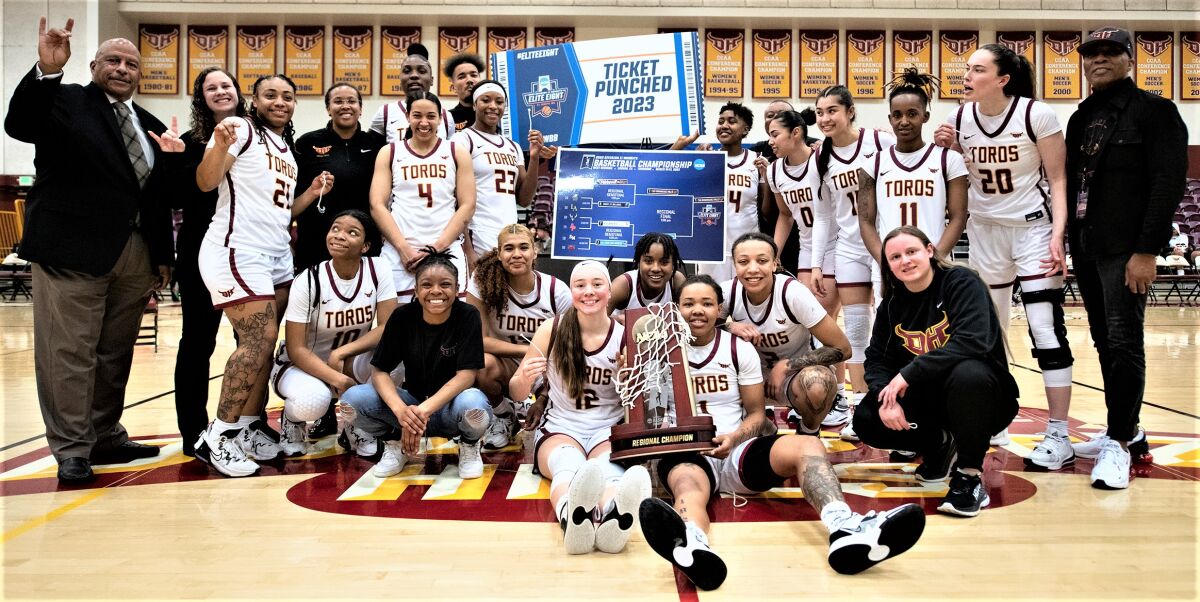 The Cal State Dominguez Hills women's basketball team poses for a photo after advancing to the Elite Eight.