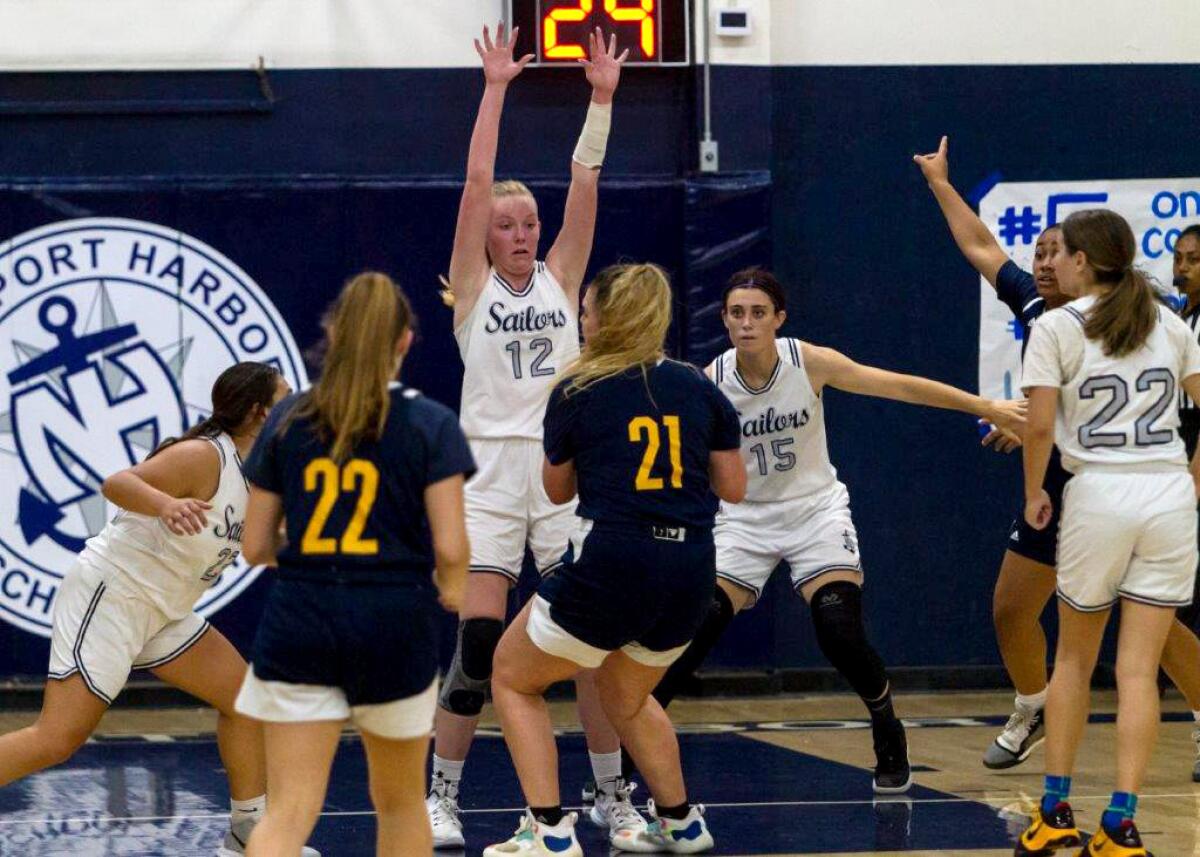 Newport Harbor's Emma Coatsworth defends the paint against Rancho Christian 