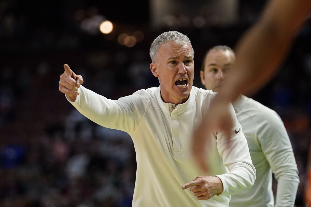 USC coach Andy Enfield reacts to a referee's call during the second half against Miami.