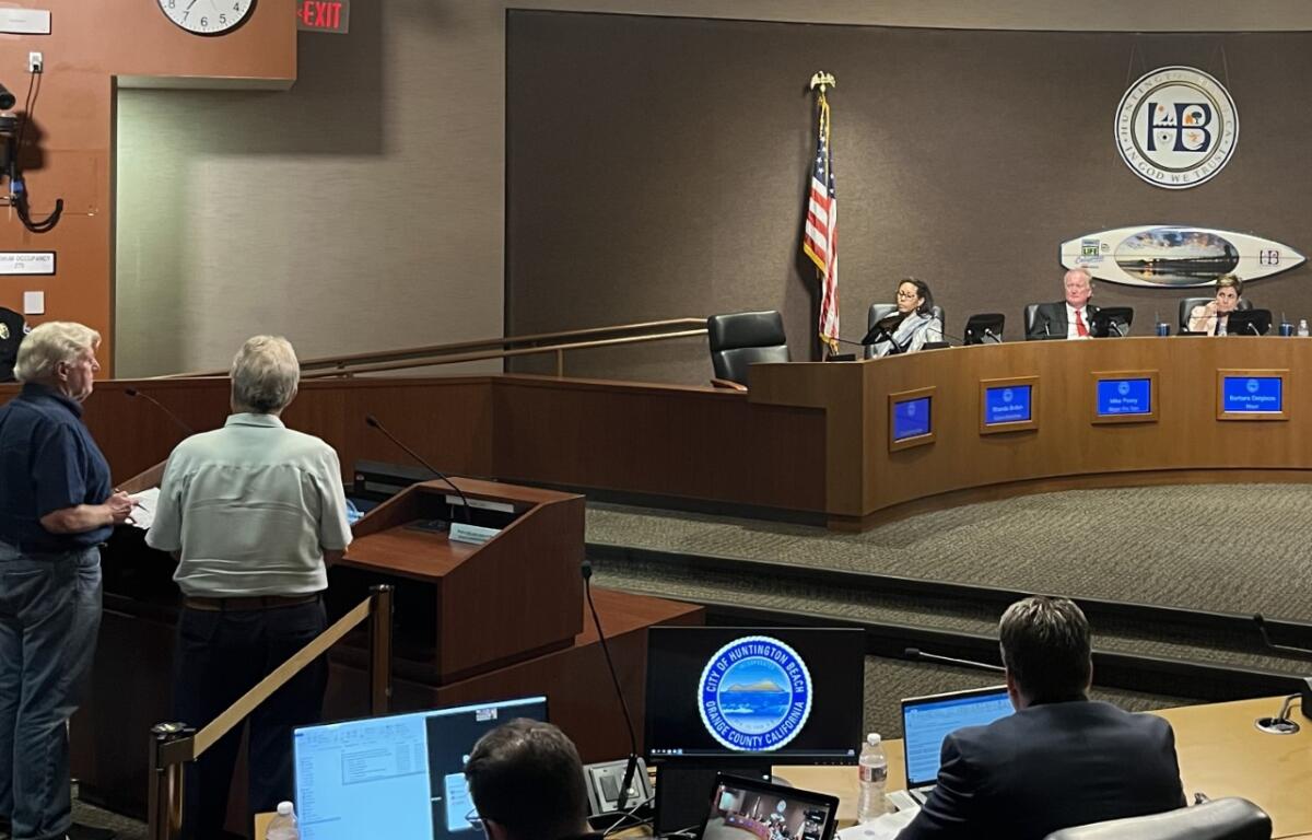 City Council members Rhonda Bolton, Mike Posey and Mayor Barbara Delgleize listen to Mackey Davis, left, speak Tuesday.