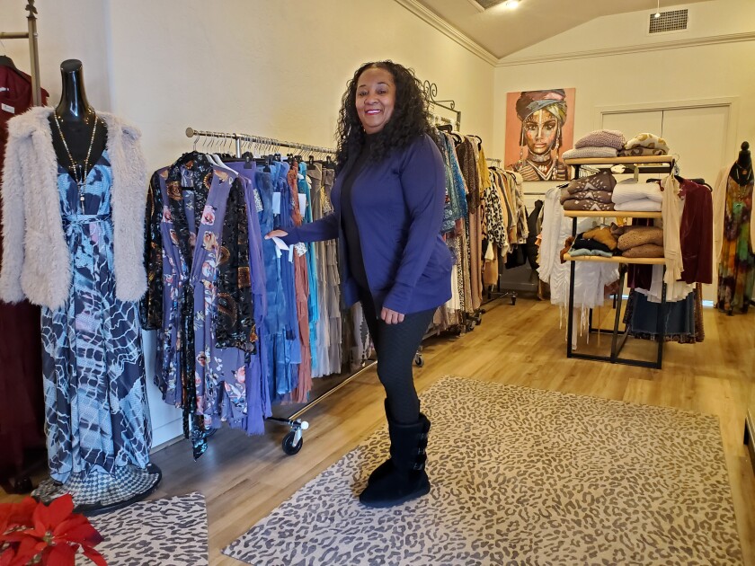 Razzmata'zz store owner Artillia Marcellous shows off some of her store's offerings at 7556 Fay Ave.