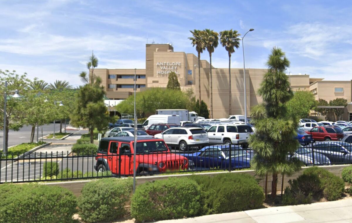 Exterior of Antelope Valley Hospital in Lancaster with cars in the parking lot.