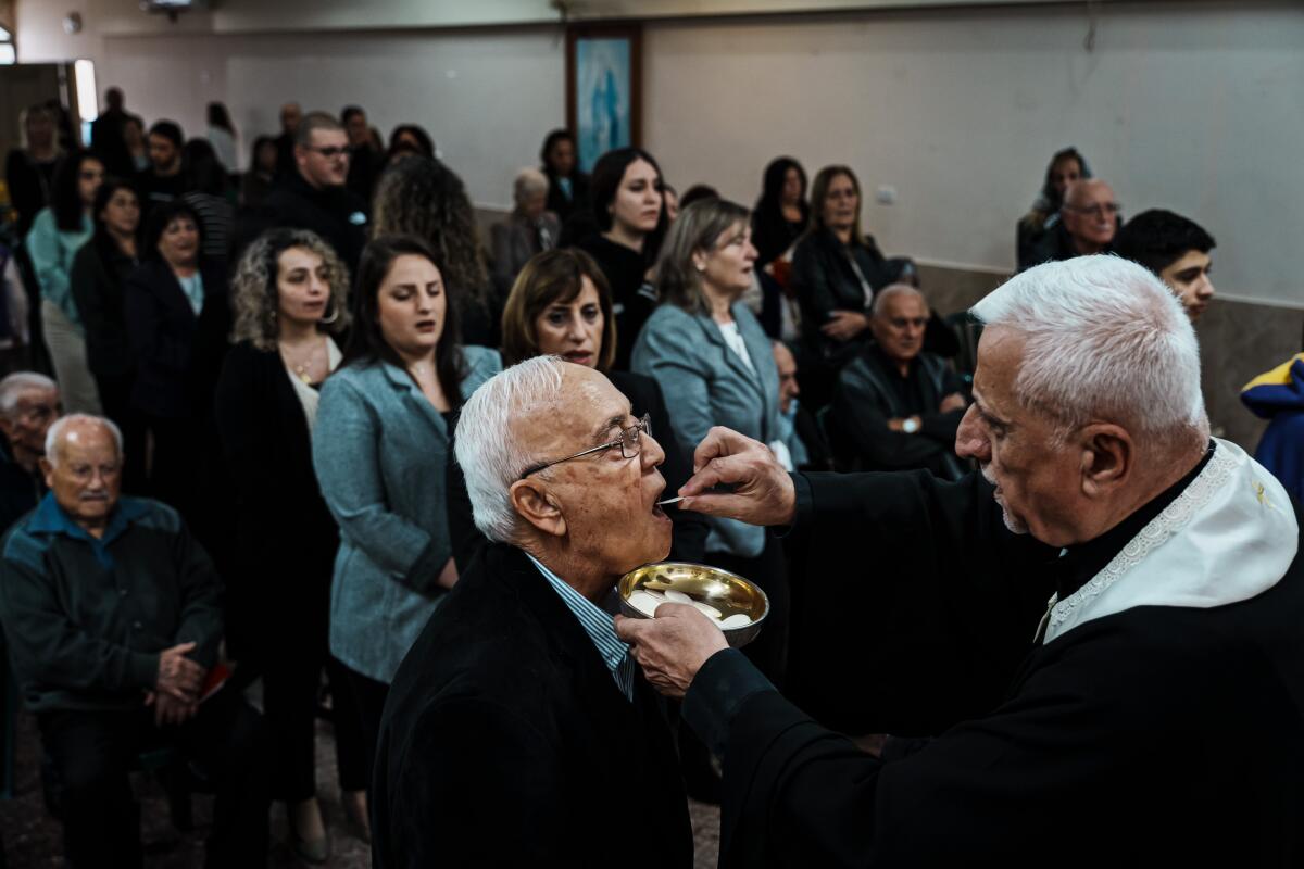 A man receives the sacrament during a church service.