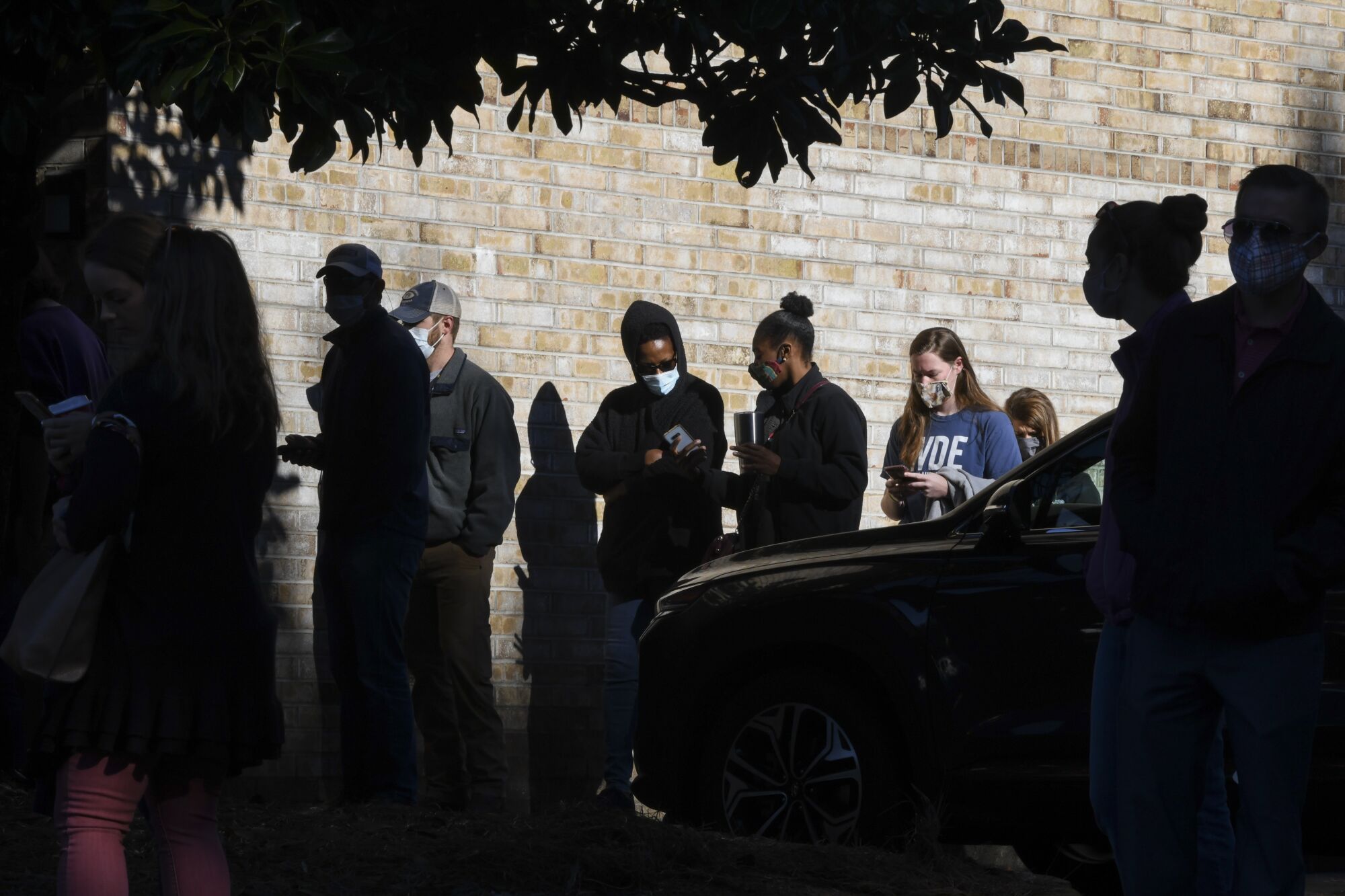 Voters wait in line to cast their ballots Nov. 3 in Auburn, Ala.
