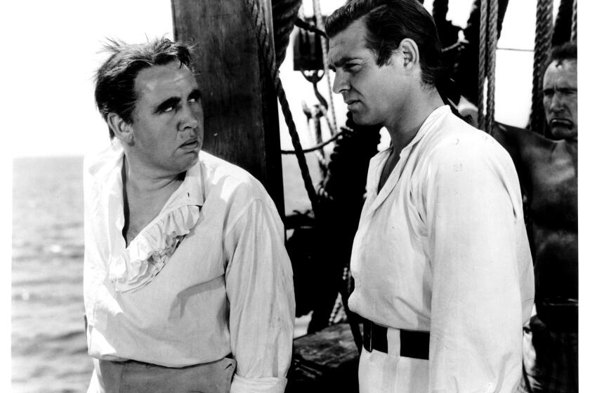 Charles Laughton and Clark Gable standing on deck in a scene from the film 'Mutiny On The Bounty', 1935. (Photo by Metro-Goldwyn-Mayer/Getty Images)