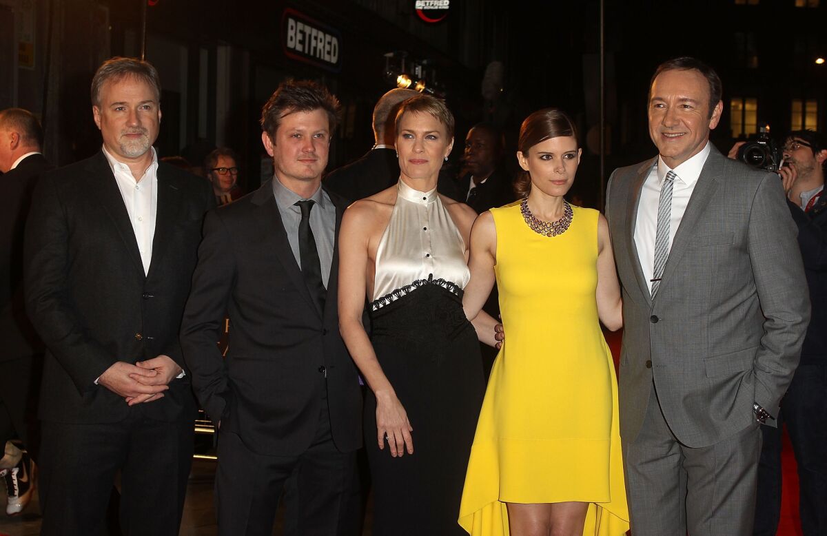 Netflix premiered its new original series "House of Cards," in London. Director David Fincher, left, is joined by Beau Willimon, Robin Wright, Kate Mara and Kevin Spacey on the red carpet.