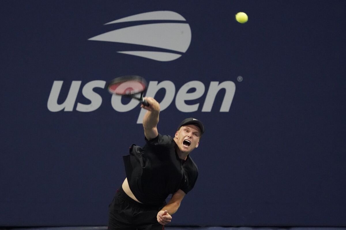 Jenson Brooksby, of the United States, serves the ball during the first round of the US Open tennis championships, Tuesday, Aug. 31, 2021, in New York. (AP Photo/Elise Amendola)