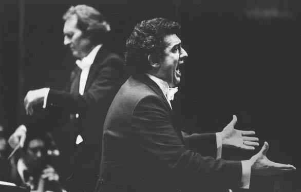 Tenor Placido Domingo sings with the Los Angeles Philharmonic in 1980 as Carlo Maria Giulini conducts in the background.