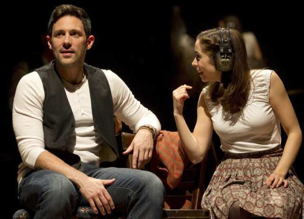 Steve Kazee, left, and Cristin Milioti are shown in a scene from the musical "Once" in New York.