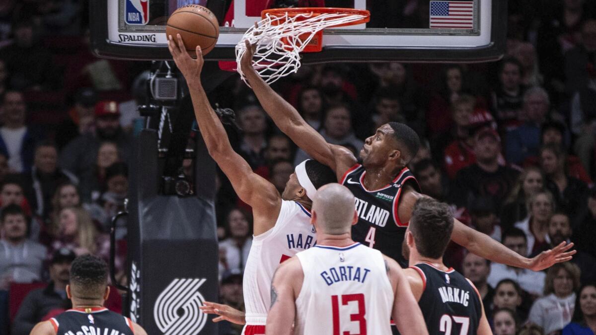 Portland's Maurice Harkless (4) tries to defend the Clippers' Tobias Harris during the game on Sunday.