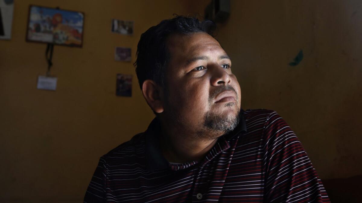 SAN PEDRO SULA, HONDURAS--NOV.7, 2018--Pastor Danny Pacheco has spent the last five years working to make Rivera Hernadez a safer place. He knew that to make it safer, the community had to feel like they could trust police officers. Despite the drop in the crime and murder rate, many Honduras want to leave due to lack of jobs and opportunities. (Carolyn Cole/Los Angeles Times)
