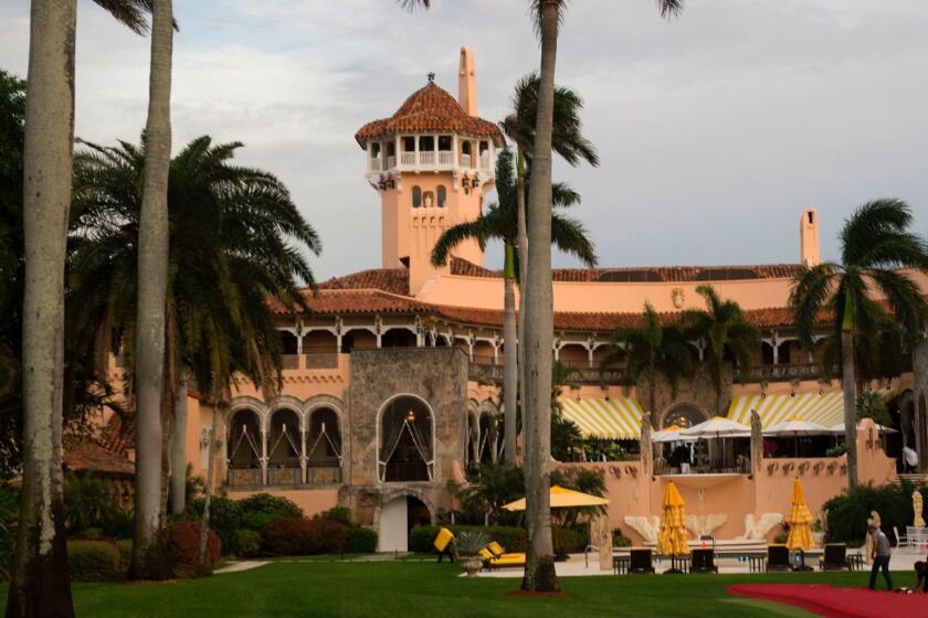 (FILES) This file photo taken on December 30, 2016 shows workers as they lay out the red carpet at Mar-a-Lago Club in Palm Beach, Florida. A US court has asked President Donald Trump's staff to turn over records of visitors to his Mar-a-Lago estate in Florida, according to a ruling made public on July 17, 2017. As president, Trump has visited his southern bolthole -- which he calls the "Winter White House" -- seven times between February and May when it closed for the season, according to an AFP tally. / AFP PHOTO / Don EMMERTDON EMMERT/AFP/Getty Images ** OUTS - ELSENT, FPG, CM - OUTS * NM, PH, VA if sourced by CT, LA or MoD **